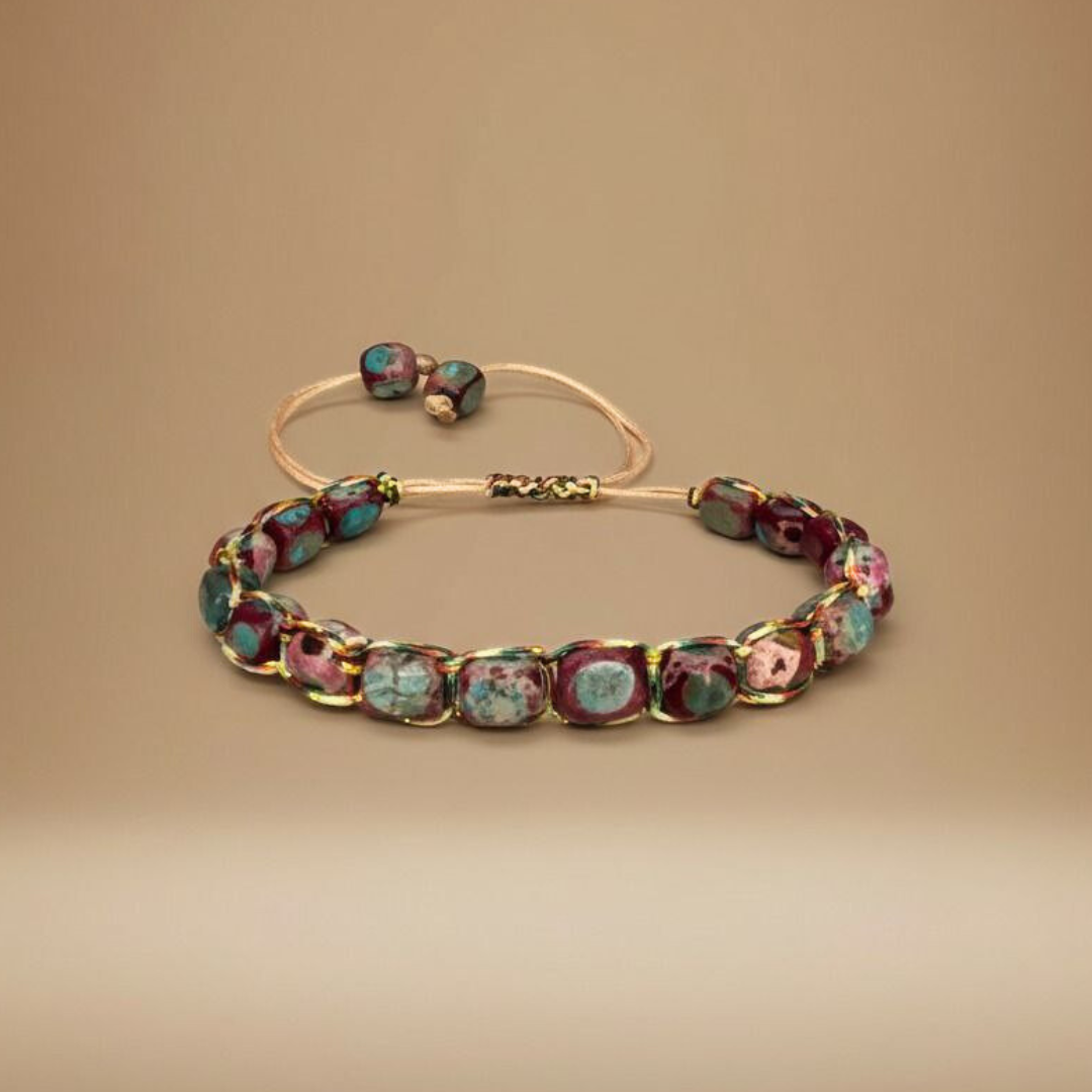 Bracelet with multicolored beads on a beige background