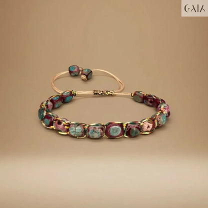 Bracelet with multicolored beads on a beige background