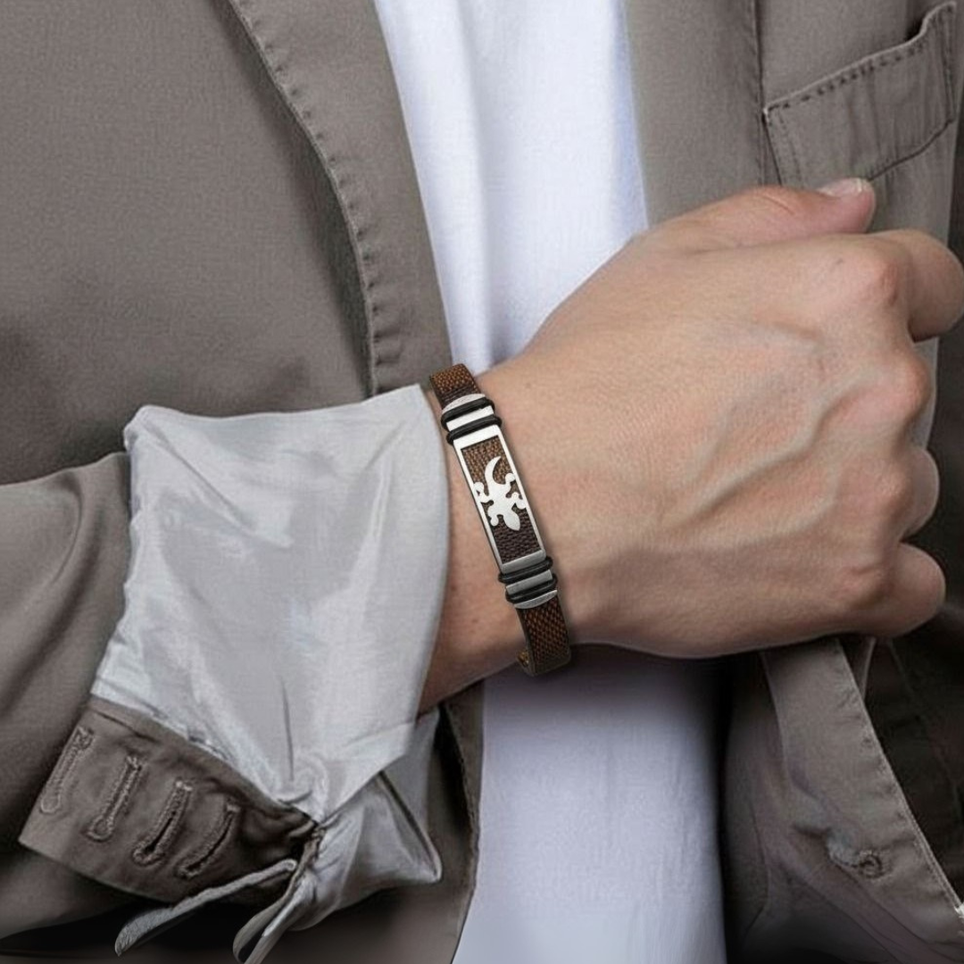 Person wearing a bracelet with a detailed design, holding a jacket sleeve.