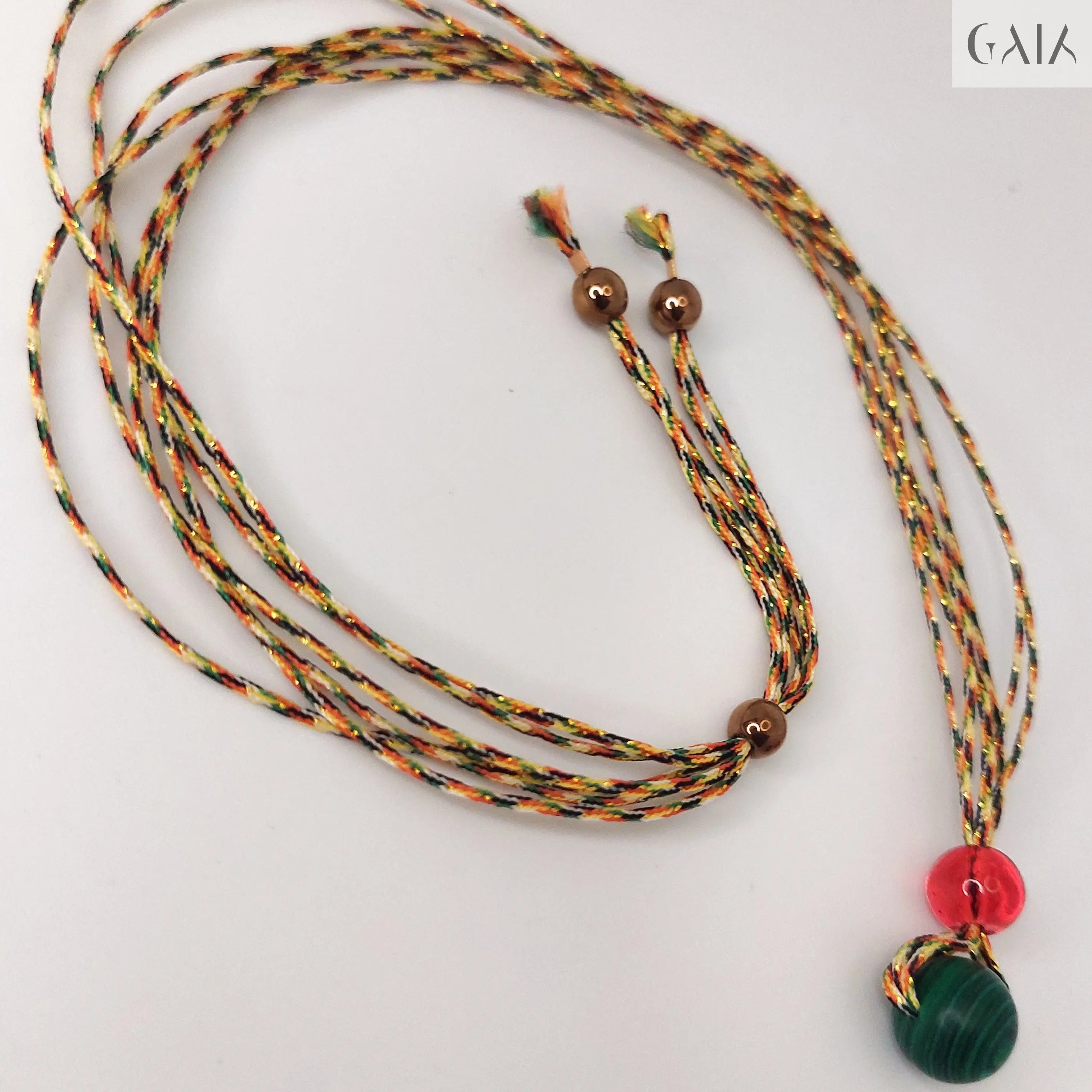 Necklace with colorful beads on a black mannequin bust

