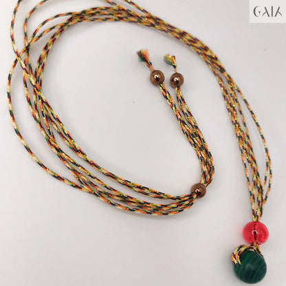 Necklace with colorful beads on a black mannequin bust

