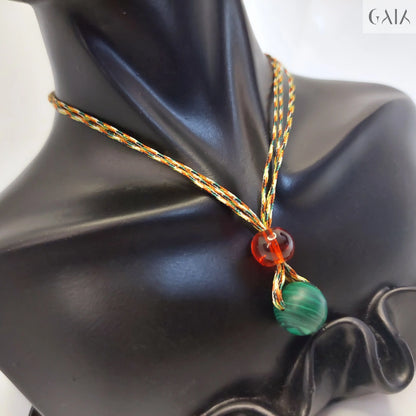 Necklace with colorful beads on a black mannequin bust

