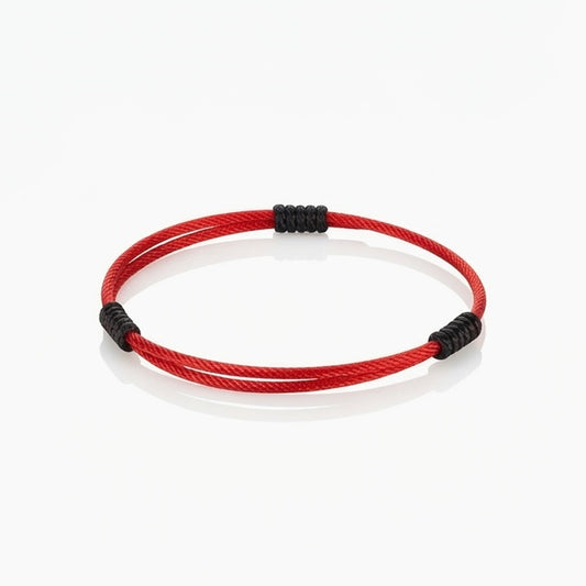 Minimal red cord bracelet with black wrapped knot details.